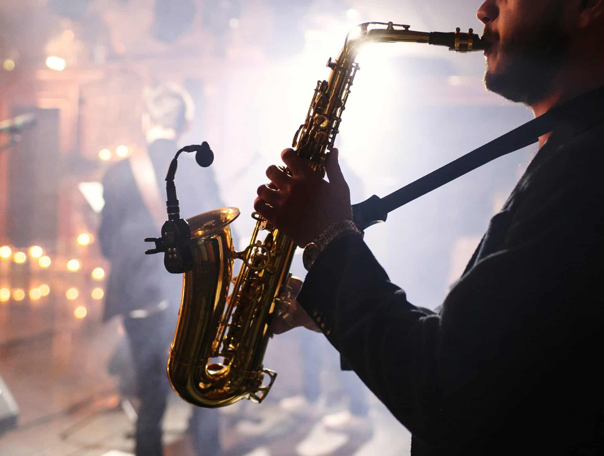 Man plays on a saxophone